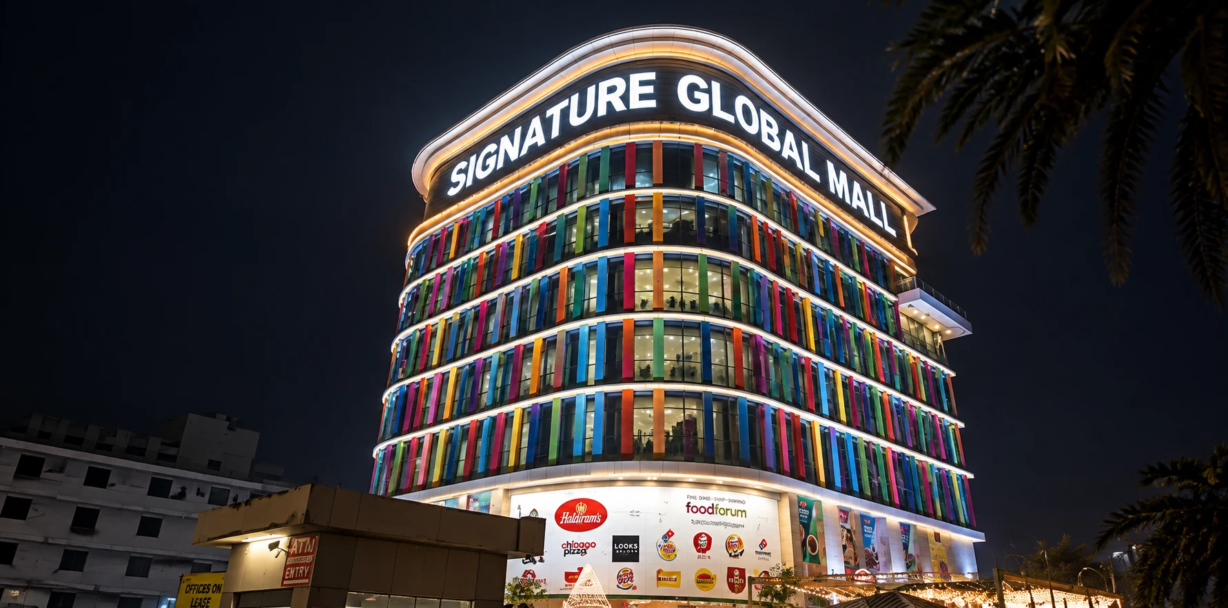 Signature Global Mall exterior illuminated at night
